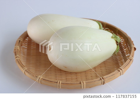 White eggplant on a colander on a white background White eggplant on a colander on a white background 117837155