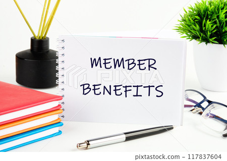 Member Benefits, e-commerce conceptual. MEMBER BENEFITS words written on a white sheet of an open notebook Member Benefits, e-commerce conceptual. MEMBER BENEFITS words written on a white sheet of an open notebook 117837604