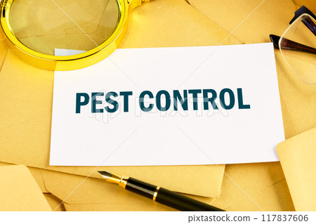PEST CONTROL written on the card against the background of scattered envelopes 117837606