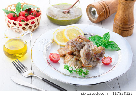 Sauteed chicken with pesto sauce 117838125