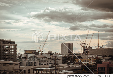 View of Construction of tall buildings with a crane and background of Dramatic sky in the city of Bangkok. 117838144