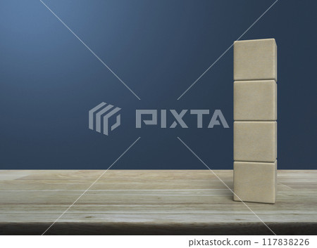 Four wood block cubes on wooden table Four wood block cubes on wooden table 117838226