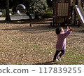 Girls chasing soap bubbles 117839255