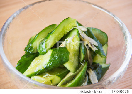 Pickled cucumbers in a glass bowl 117840076