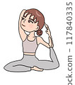Woman doing yoga pigeon pose 117840335