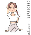 Woman doing yoga cow face pose 117840339