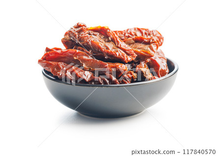 Sun dried red tomatoes in bowl isolated on white background. 117840570