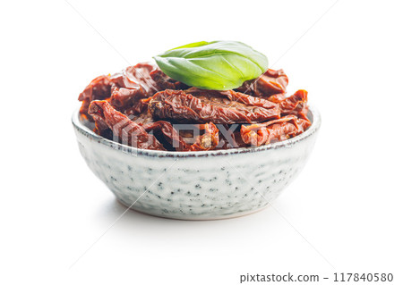 Sun dried red tomatoes in bowl isolated on white background. 117840580