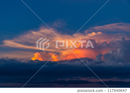 Cumulonimbus clouds in the blue summer sky, dyed by the setting sun b-1 High saturation contrast Cumulonimbus clouds in the blue summer sky, dyed by the setting sun b-1 High saturation contrast 117840647