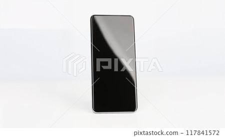 Black smartphone stands upright on a white background 117841572