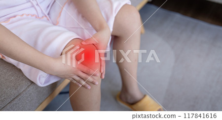 Woman Experiencing Knee Pain at Home. Understanding Joint Discomfort Woman Experiencing Knee Pain at Home. Understanding Joint Discomfort 117841616