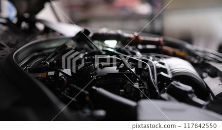 Open engine hood of a automobile, close-up 117842550