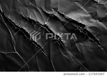 Rips and cracks in black paper with rough abstract pattern. Scratched grunge dark backgrounds Rips and cracks in black paper with rough abstract pattern. Scratched grunge dark backgrounds 117843987