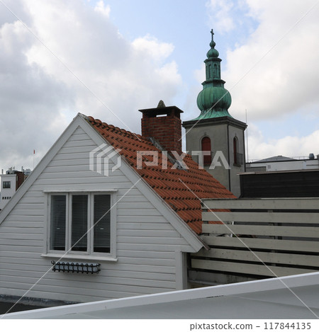 Roofs of old houses and church tower in Stavanger, Norway. Roofs of old houses and church tower in Stavanger, Norway. 117844135