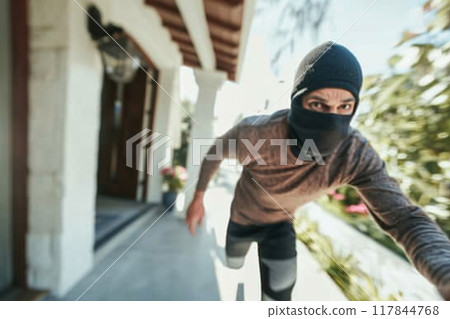 Masked Person Running Towards Camera in Residential Area 117844768