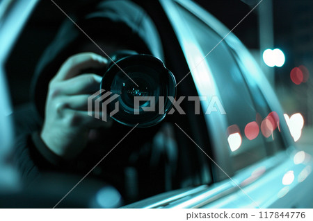 Photographer in Car at Night Capturing a Scene Photographer in Car at Night Capturing a Scene 117844776