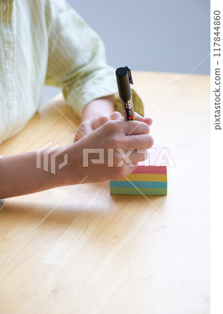 A young woman visualizing issues in the office A young woman visualizing issues in the office 117844860