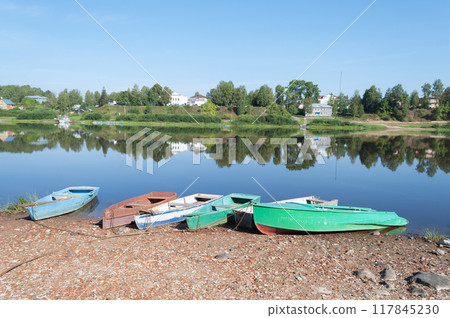 Old boats on the riverbank 117845230