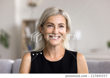 Headshot portrait pretty blonde woman looking at camera 117845557
