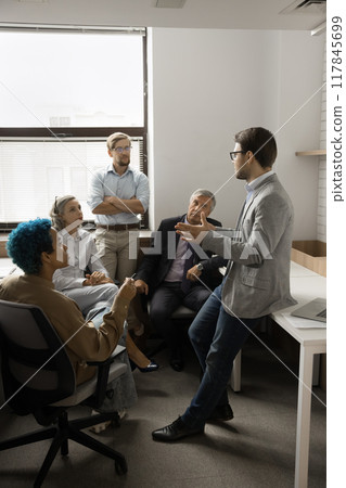 Group of professionals engaged in meeting in coworking Group of professionals engaged in meeting in coworking 117845699