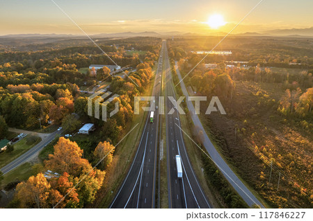 USA highway transportation infrastructure at sunset. American freeway road with fast driving cars 117846227
