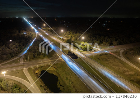 USA highway transportation infrastructure. American freeway junction with fast driving cars USA highway transportation infrastructure. American freeway junction with fast driving cars 117846230