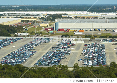Used damaged cars on auction reseller company big parking lot ready for resale services. Sales of secondhand vehicles for rebuilt or salvage title Used damaged cars on auction reseller company big parking lot ready for resale services. Sales of secondhand vehicles for rebuilt or salvage title 117846232