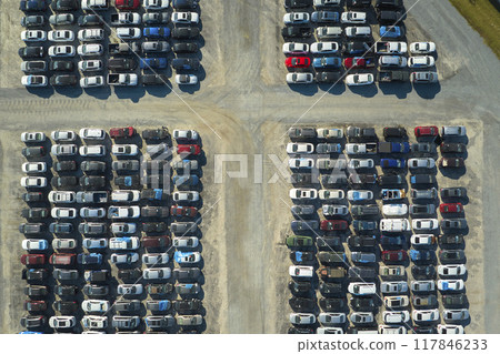 Used damaged cars on auction reseller company big parking lot ready for resale services. Sales of secondhand vehicles for rebuilt or salvage title 117846233