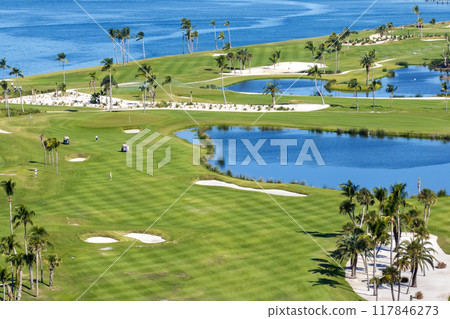 Waterfront golf course in Florida. Sports grounds with green grass in Boca Grande, small town on Gasparilla Island 117846273