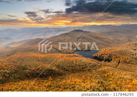 Wooded Appalachian mountains in North Carolina at sunset with yellow forest trees at fall season. Beauty of autumnal nature 117846293