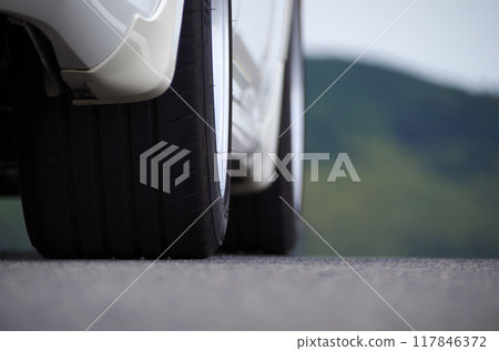 A low-angle photo of the contact area of a high-grip tire 117846372