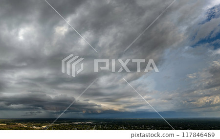 Stormy cumulonimbus clouds forming before thunderstorm on dark sky. Moving and changing cloudscape weather Stormy cumulonimbus clouds forming before thunderstorm on dark sky. Moving and changing cloudscape weather 117846469