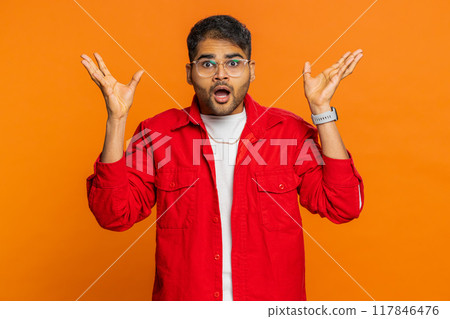 Excited amazed Indian man touching head showing explosion celebrating success, good idea, answer 117846476
