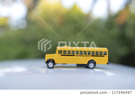 Toy american yellow school bus as symbol of education in the USA 117846497