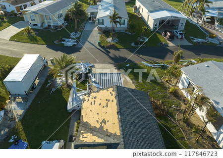 Property damage from strong hurricane winds. Mobile homes in Florida residential area with destroyed rooftops. Consequences of natural disaster Property damage from strong hurricane winds. Mobile homes in Florida residential area with destroyed rooftops. Consequences of natural disaster 117846723