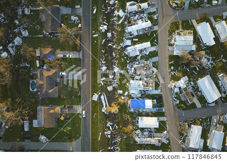 Destroyed by hurricane Ian suburban houses in Florida mobile home residential area. Consequences of natural disaster 117846845