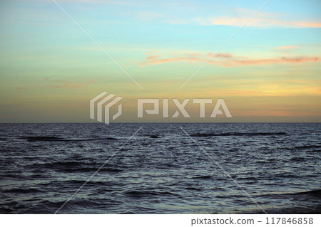 Dramatic red ocean waves at sunset with soft evening sea dark water 117846858