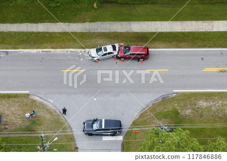 First responders personnel and vehicles responding to car accident site on American street in Florida. Emergency services helping victims of vehicle crash on road in USA First responders personnel and vehicles responding to car accident site on American street in Florida. Emergency services helping victims of vehicle crash on road in USA 117846886