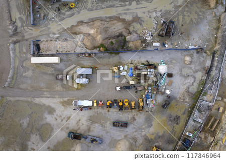 Beginning of construction works on prepared ground. Large building site with scattered equipment in american rural area. Development of residential housing in US suburbs. Real estate market in USA 117846964