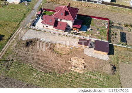Aerial view of residential house with backyard in suburban rural area 117847091