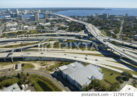 American freeway intersection with fast driving cars and trucks. View from above of USA transportation infrastructure 117847162