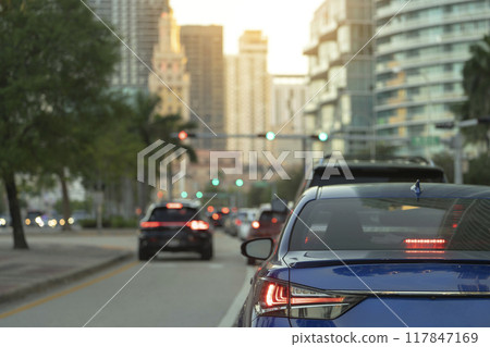 American street with driving cars at intersection with traffic lights in Miami, Florida. USA transportation American street with driving cars at intersection with traffic lights in Miami, Florida. USA transportation 117847169