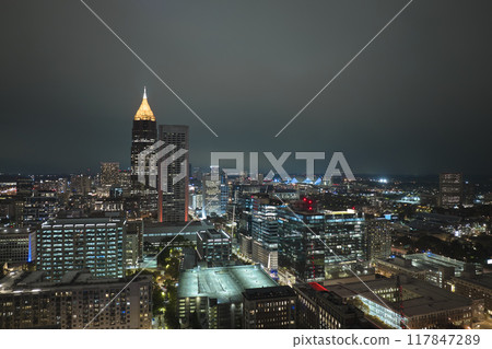 Aerial view of downtown district of Atlanta city in Georgia, USA. Brightly illuminated high skyscraper buildings in modern American midtown 117847289