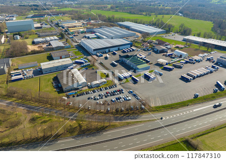 Aerial view of goods warehouses and logistics center in industrial city zone from above 117847310