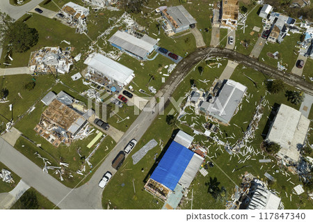 Aerial view of natural disaster consequences in Florida Southwest region. Severely damaged by hurricane Ian mobile homes in residential area Aerial view of natural disaster consequences in Florida Southwest region. Severely damaged by hurricane Ian mobile homes in residential area 117847340