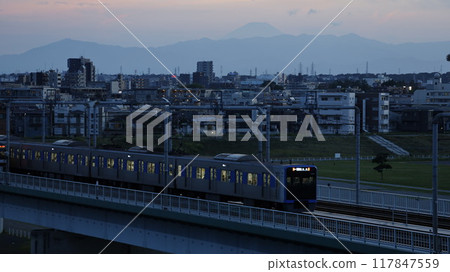 A Tokyu train crossing the Tamagawa Bridge with Mount Fuji visible in the background, seen from the observation deck at Tamagawa Sengen Shrine (Ota Ward, Tokyo) 117847559