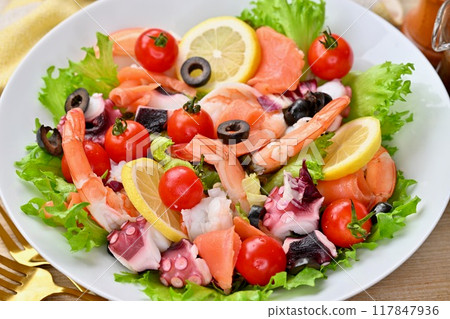 Salad deli, hearty seafood salad, vegetables, raw vegetables, shrimp, octopus, and smoked salmon. Salad deli, hearty seafood salad, vegetables, raw vegetables, shrimp, octopus, and smoked salmon. 117847936