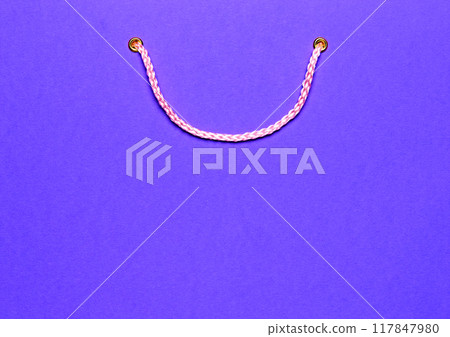 Close-up of blue shopping bag with handles, symbolizing shopping period and retail. Close-up of blue shopping bag with handles, symbolizing shopping period and retail. 117847980