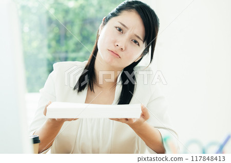 A woman with a document 117848413