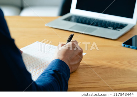 A man filling out an inheritance tax return 117848444